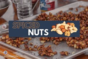 Tray of roasted spiced nuts Apple Texas pepper jelly in background